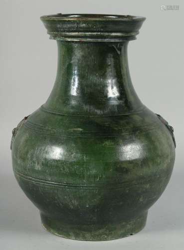 A LARGE CHINESE GREEN GLAZE TWIN HANDLE POTTERY VASE, with m...