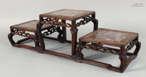 A CHINESE RED MARBLE INSET THREE TIER HARDWOOD STAND, with t...