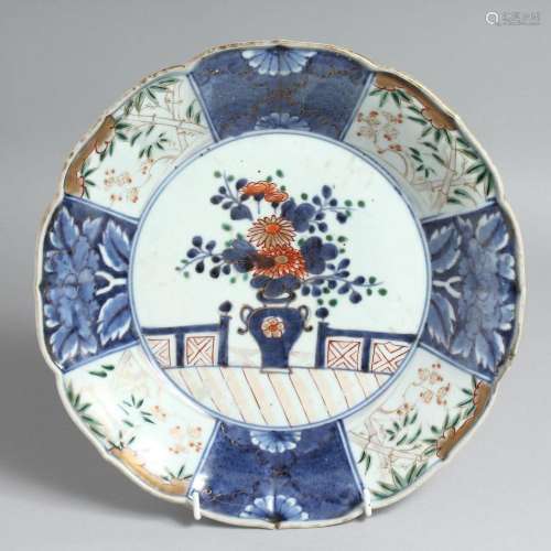 A JAPANESE IMARI PORCELAIN DISH, decorated in blue and white...