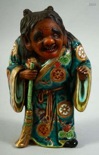 A JAPANESE KUTANI POTTERY FIGURE of Jittoku, 20.5cm high.