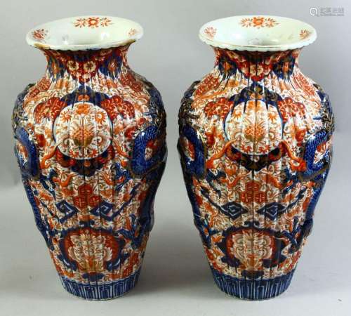 A LARGE PAIR OF JAPANESE IMARI PORCELAIN VASES, each with ri...