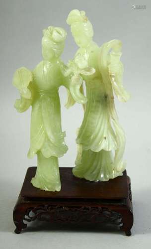 A CHINESE JADE FIGURAL GROUP ON A HARDWOOD STAND, the jade c...