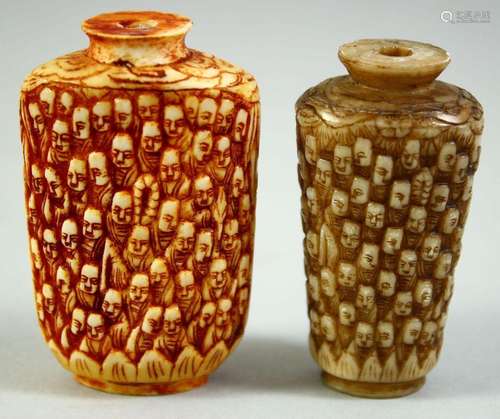 TWO CARVED BONE SCENT BOTTLES, carved with multiple faces, 6...