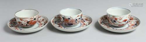 A SET OF THREE JAPANESE IMARI PORCELAIN CUPS AND SAUCERS, ea...