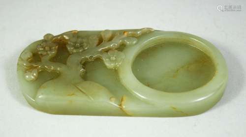 A CHINESE CARVED JADE INK STONE, 11cm x 6cm.