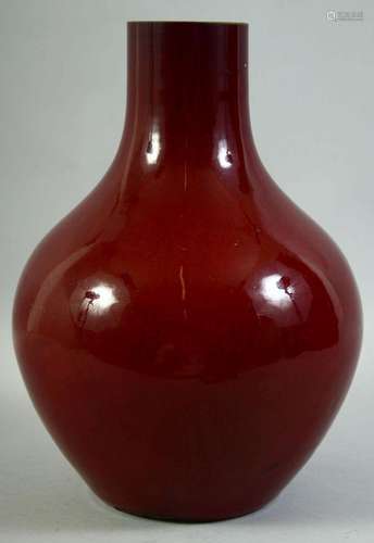 A LARGE CHINESE SANG DE BOEUF GLAZE VASE, 32.5cm high.