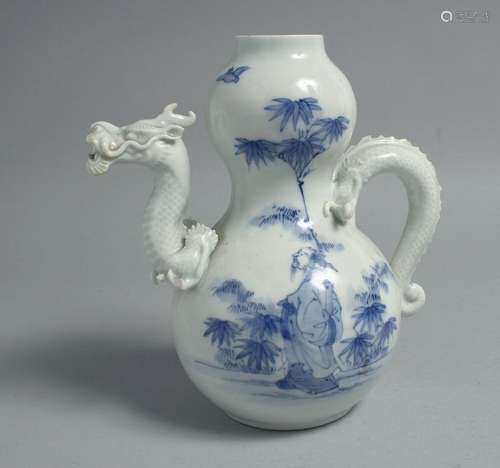 A JAPANESE BLUE AND WHITE HIRADO PORCELAIN GOURD SHAPE EWER,...