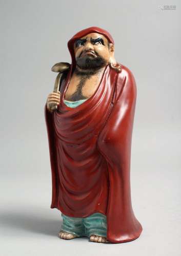 A JAPANESE KUTANI PORCELAIN FIGURE, of a bearded man holding...