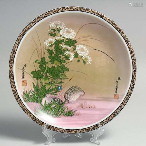 A CONTEMPORARY CHINESE PORCELAIN PLATE, decorated with quail...