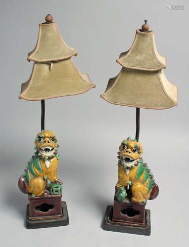 A PAIR OF CHINESE SANCAI PORCELAIN FOO DOG LAMPS, 38.5cm hig...