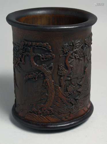 A LARGE CHINESE CARVED HARDWOOD BRUSH POT, carved with a lan...