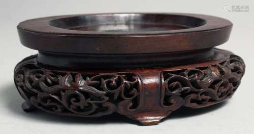 A CHINESE CARVED AND PIERCED OVAL SHAPE HARDWOOD STAND, 15cm...