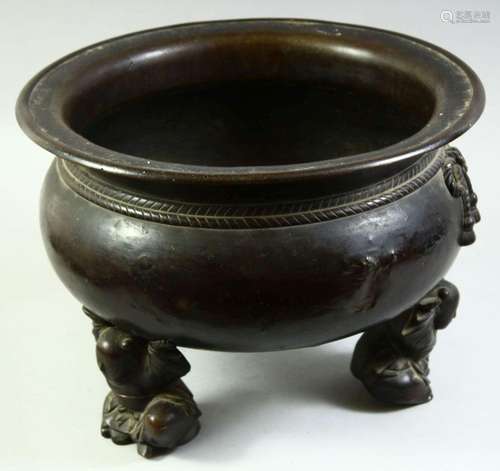 A VERY LARGE CHINESE BRONZE TRIPOD CENSER, the feet formed a...