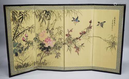 A GOOD CHINESE FOLDING FOUR PANEL SCREEN, the panels with a ...