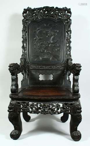 A LARGE CHINESE CARVED ROSEWOOD THRONE / ARMCHAIR, the crest...