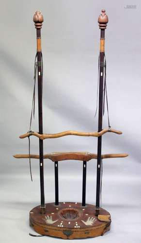 AN UNUSUAL CHINESE HARDWOOD TORTURE DEVICE, consisting of po...