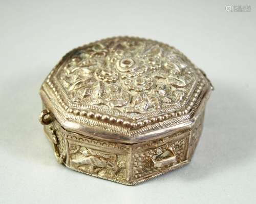 AN ISLAMIC WHITE METAL OCTAGONAL QUR`AN AMULET BOX, possibly...