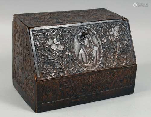 A PERSIAN QAJAR CARVED WOOD STATIONARY BOX, well carved with...