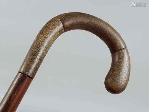 AN ANTIQUE RHINO HORN WALKING STICK, 85cm long.