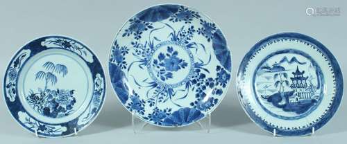 THREE CHINESE BLUE AND WHITE PLATES, two with floral decorat...