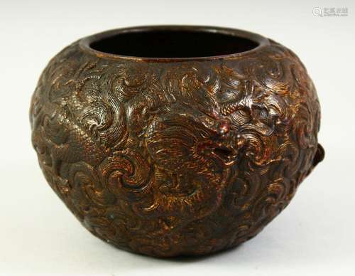 A SMALL CHINESE BRONZE BOWL with raised decoration depicting...