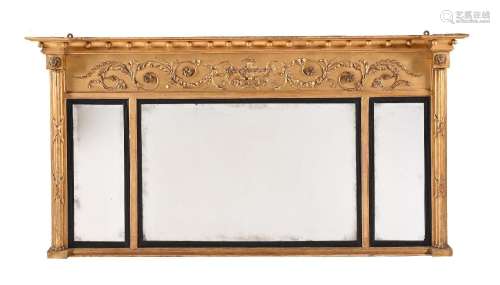 A REGENCY GILTWOOD AND COMPOSITION OVERMANTEL WALL MIRROR