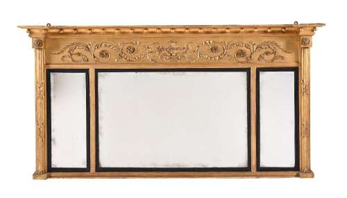 A REGENCY GILTWOOD AND COMPOSITION OVERMANTEL WALL MIRROR