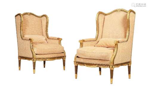 A PAIR OF GILTWOOD AND UPHOLSTERED HIGH BACK ARMCHAIRS