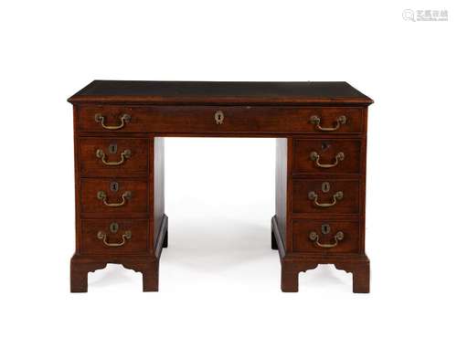 A GEORGE III MAHOGANY FREESTANDING PEDESTAL DESK