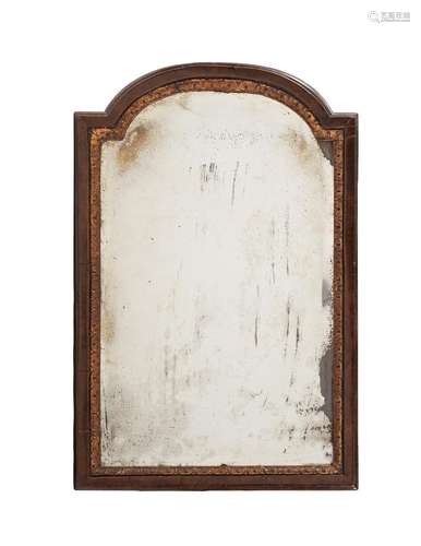 A WALNUT AND PARCEL GILT WALL MIRROR