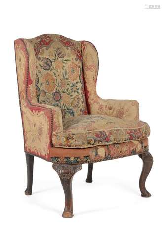 A WALNUT AND NEEDLEWORK UPHOLSTERED WING ARMCHAIR IN GEORGE ...