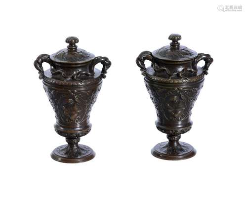 A PAIR OF BRONZE MODELS OF URNS AND COVERS