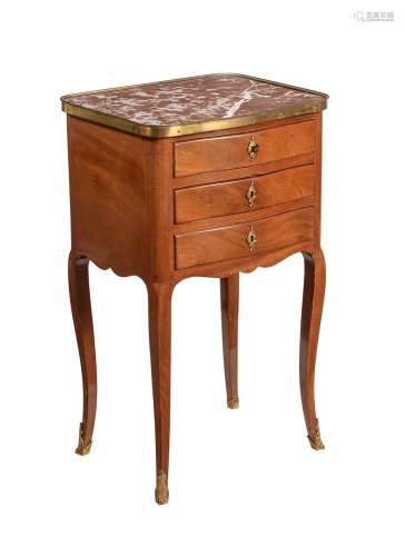 A FRENCH WALNUT AND MARBLE TOPPED PETITE COMMODE IN LOUIS XV...
