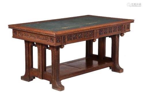AN EARLY VICTORIAN OAK LIBRARY TABLE, IN THE MANNER OF A W N...