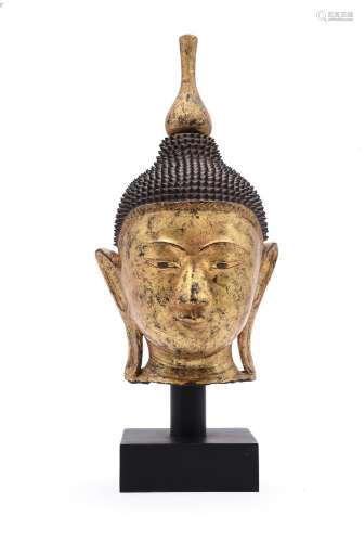 A BURMESE GILT-WOOD HEAD OF BUDDHA