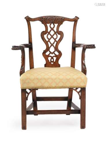 A CARVED MAHOGANY ARMCHAIR IN 'CHIPPENDALE' STYLE