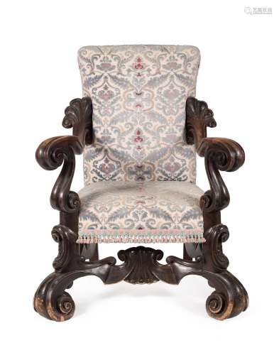 AN ITALIAN CARVED WALNUT AND UPHOLSTERED ARMCHAIR