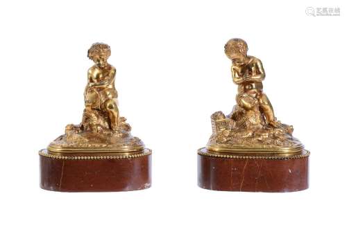 A PAIR OF GILT BRONZE MODELS OF PUTTI