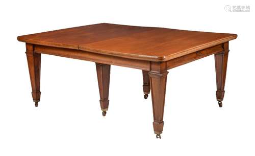 A MAHOGANY EXTENDING DINING TABLE