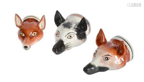 A GROUP OF TWELVE VARIOUS FOX MASK STIRRUP CUPS