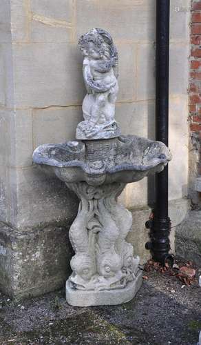 A STONE FIGURAL WALL FOUNTAIN