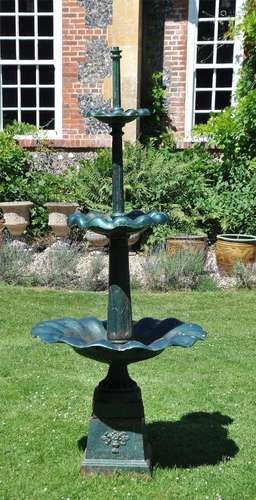 A GREEN PAINTED CAST IRON GARDEN FOUNTAIN