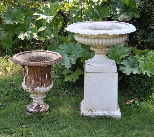 A VICTORIAN WHITE PAINTED CAST IRON CAMPAGNA SHAPED URN ON T...