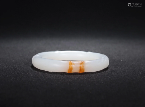 A Chinese Carved Jade Bangle