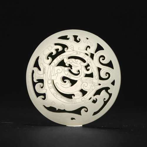 A CARVED WHITE JADE DRAGON PENDANT