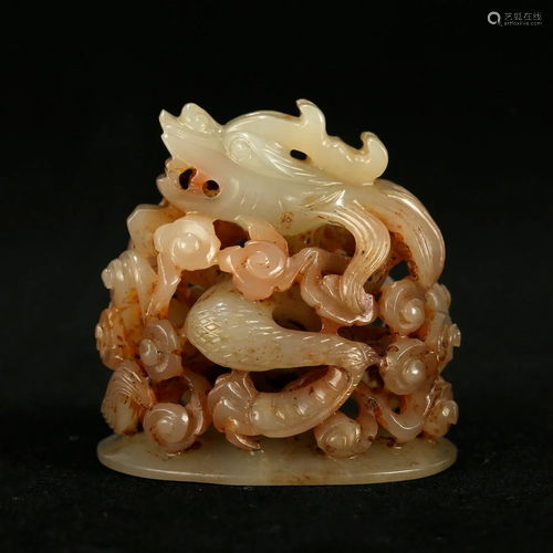 A CARVED WHITE AND RUSSET JADE INCENSE COVER