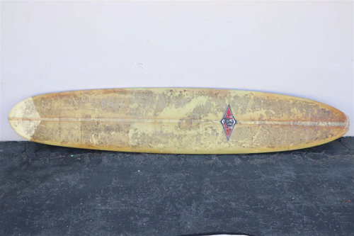 Vintage Bear surfboard with wax applied on surface