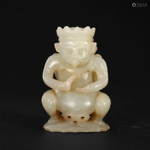 A WHITE JADE 'BEAST AND FIGURE' CARVING