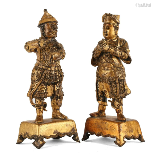 A PAIR OF GILT-BRONZE STANDING GUARDIANS