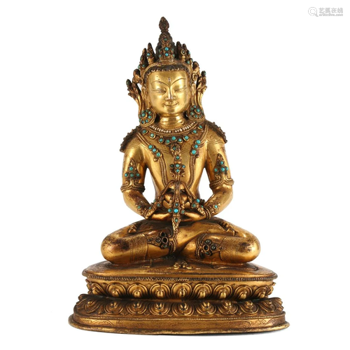 A GILT-BRONZE FIGURE OF SEATED AMITAYUS